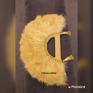 Gold feather fan